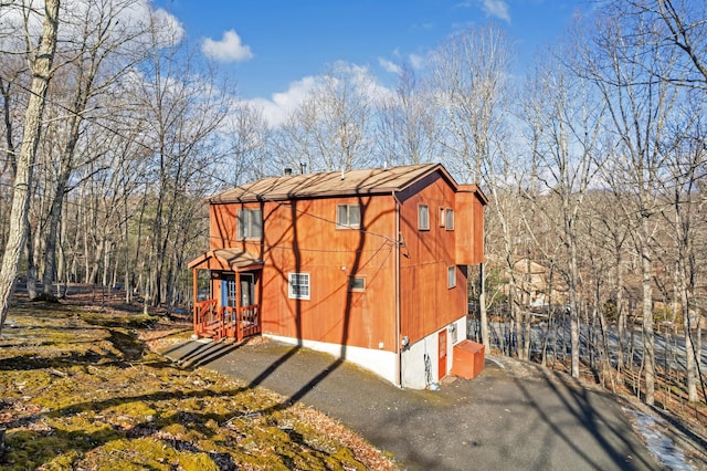 view of home's exterior with driveway