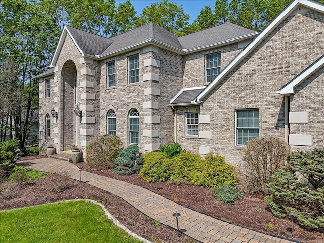 175 Wyndham Dr, Cresco, PA 18326 - view of front facade with brick siding and a shingled roof
