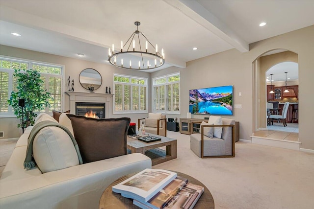 175 Wyndham Dr, Cresco, PA 18326 - living room with a glass covered fireplace, a chandelier, carpet floors, beam ceiling, and recessed lighting