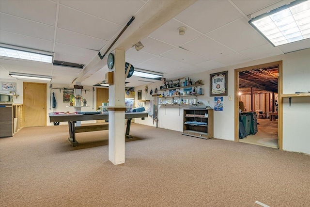 recreation room with a paneled ceiling and carpet floors