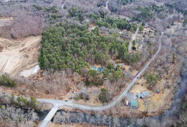 drone / aerial view with a view of trees