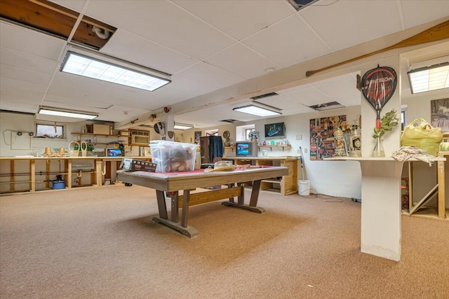 rec room with a drop ceiling and carpet floors