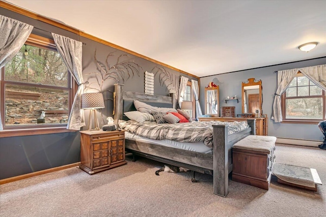 carpeted bedroom with a baseboard radiator and baseboards