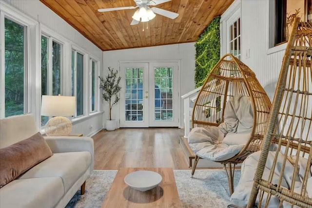 sunroom with wood ceiling, french doors, and ceiling fan