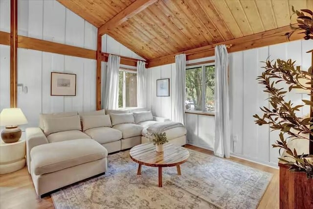 living room with lofted ceiling with beams, wood ceiling, wood finished floors, and a decorative wall