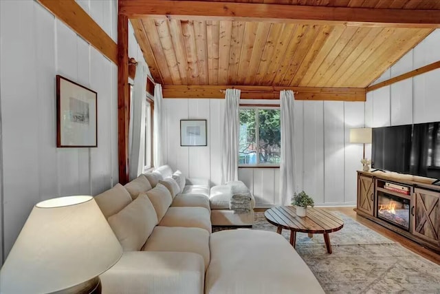 living room featuring wooden ceiling, lofted ceiling with beams, and wood finished floors