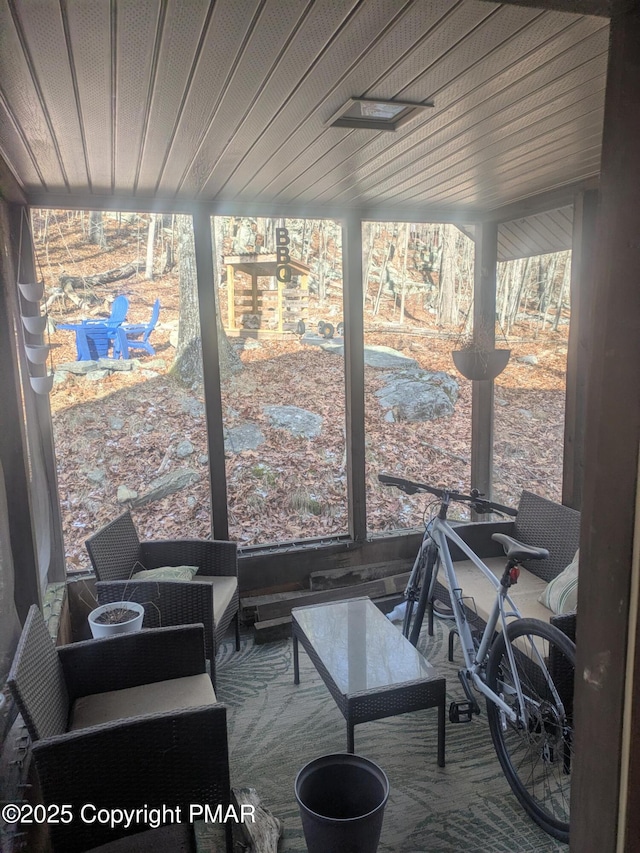 sunroom with wood ceiling