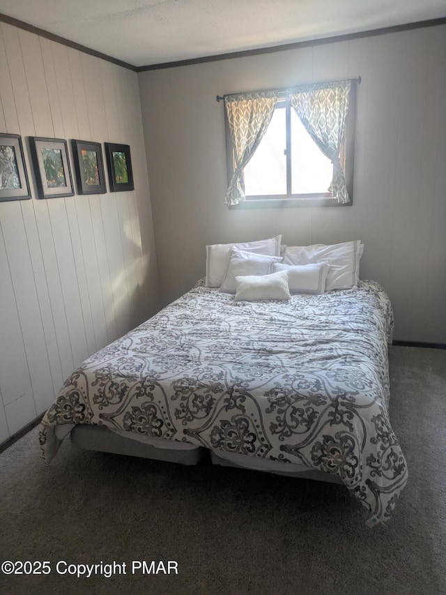 carpeted bedroom with ornamental molding