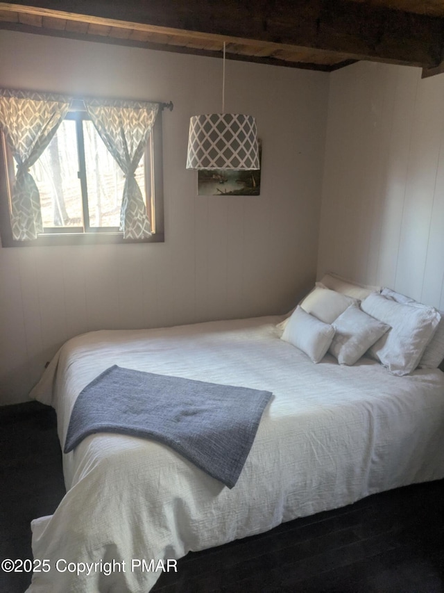 bedroom featuring beam ceiling