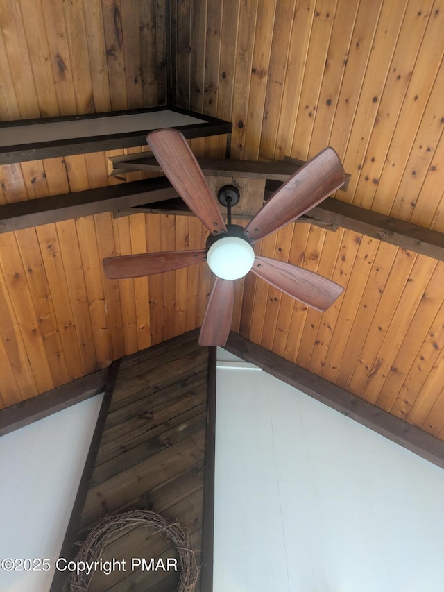 room details featuring wood ceiling, beamed ceiling, and wooden walls