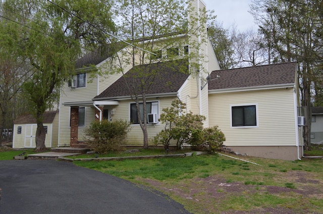 6372 Baltic Ave, Tobyhanna, PA 18466 - traditional home featuring a chimney, a shingled roof, and cooling unit