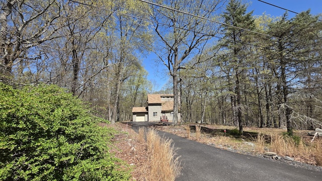 view of road featuring aphalt driveway