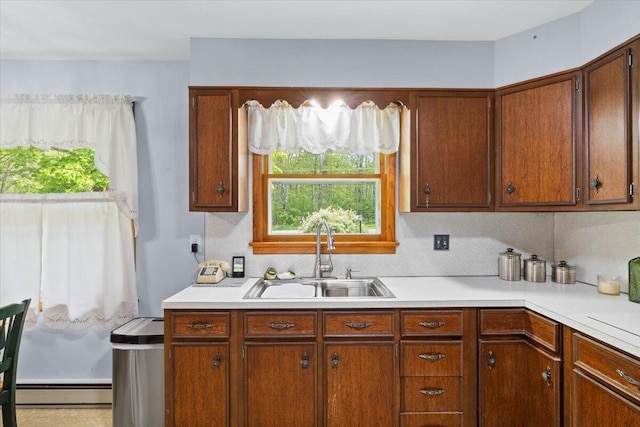 126 Keystone Ln, Tobyhanna, PA 18466 - kitchen featuring a sink, baseboard heating, light countertops, and healthy amount of natural light