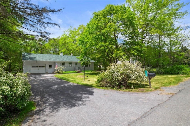 126 Keystone Ln, Tobyhanna, PA 18466 - view of front of home featuring a garage, driveway, and a front yard