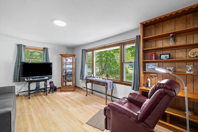 126 Keystone Ln, Tobyhanna, PA 18466 - living room featuring a baseboard radiator, healthy amount of natural light, and wood finished floors