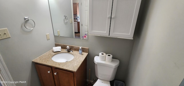 bathroom with toilet and vanity