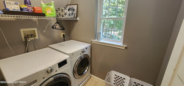 washroom featuring plenty of natural light, laundry area, independent washer and dryer, and tile patterned floors