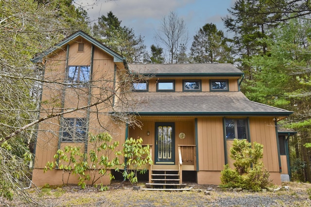 248 Miller Dr, Pocono Pines, PA 18350 - rustic home featuring a shingled roof and covered porch