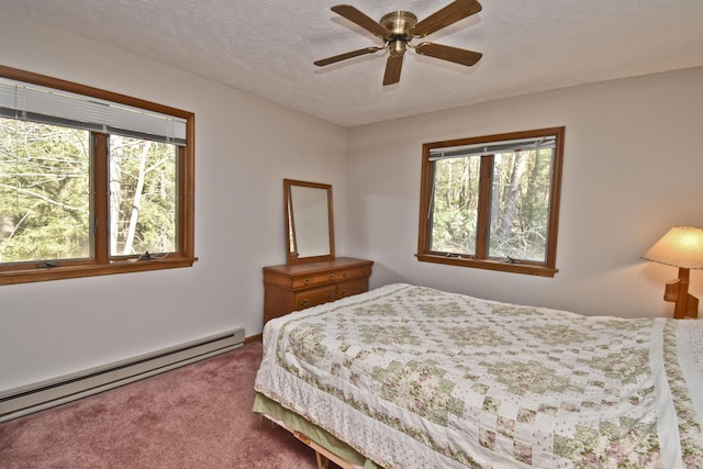 248 Miller Dr, Pocono Pines, PA 18350 - carpeted bedroom featuring a baseboard radiator, ceiling fan, and multiple windows