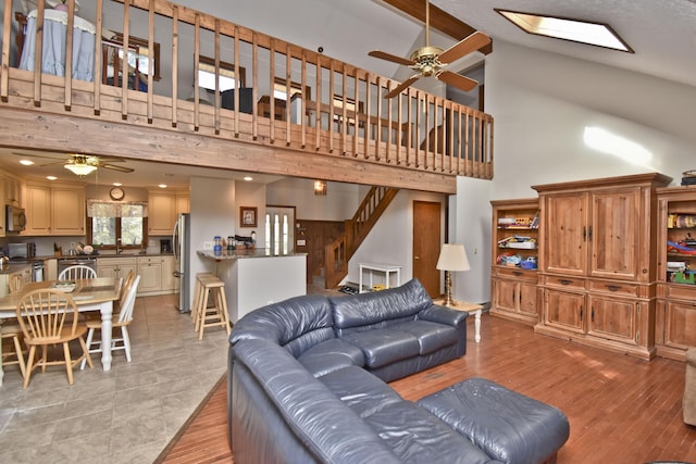 248 Miller Dr, Pocono Pines, PA 18350 - living room featuring high vaulted ceiling, ceiling fan, and stairs