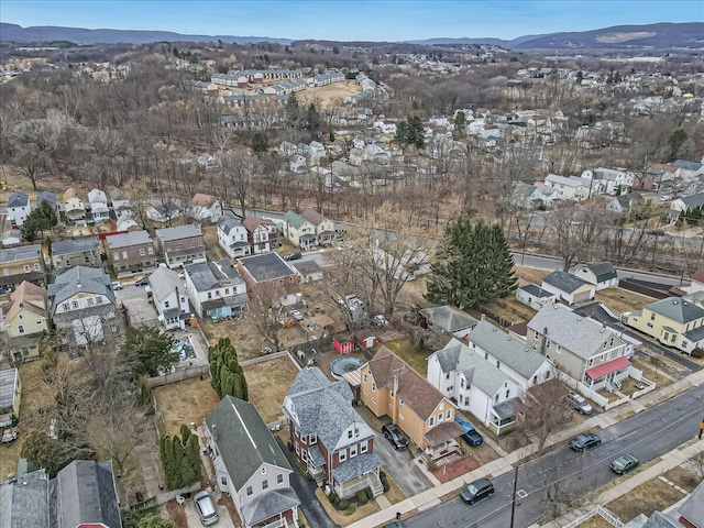 birds eye view of property with a mountain view and a residential view