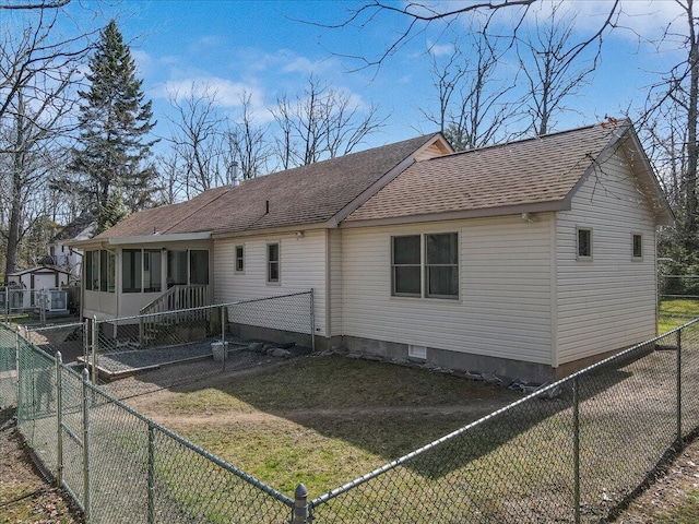 205 Flatbrook Way, Milford, PA 18337 - back of property featuring a lawn, a fenced backyard, a sunroom, and roof with shingles
