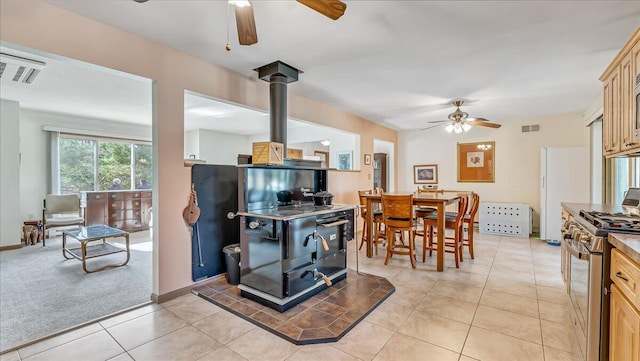 205 Flatbrook Way, Milford, PA 18337 - interior space featuring visible vents, a ceiling fan, a wood stove, and gas stove