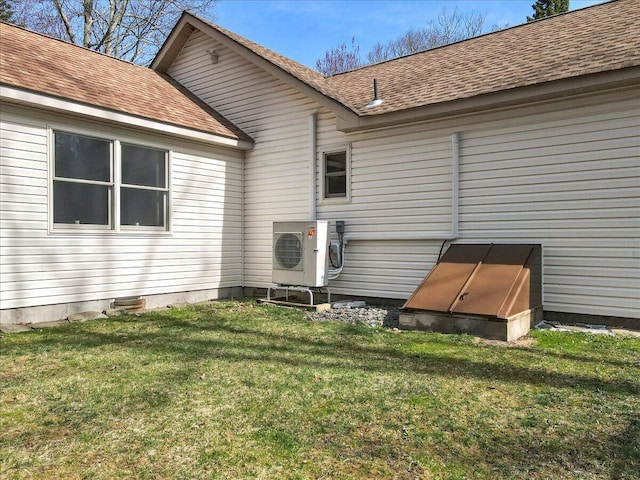 205 Flatbrook Way, Milford, PA 18337 - rear view of house with roof with shingles, ac unit, and a lawn