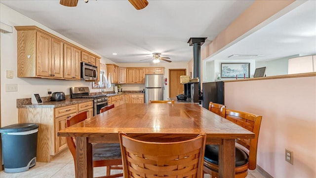 205 Flatbrook Way, Milford, PA 18337 - dining space featuring light tile patterned floors, ceiling fan, recessed lighting, and a wood stove