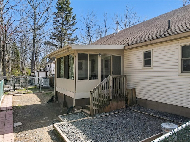 205 Flatbrook Way, Milford, PA 18337 - rear view of property featuring a gate, fence, a sunroom, and roof with shingles