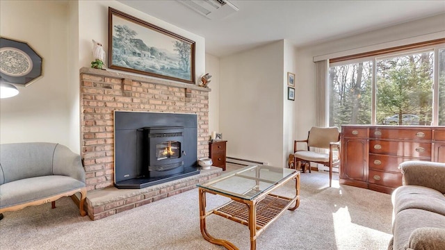 205 Flatbrook Way, Milford, PA 18337 - carpeted living room featuring visible vents, a baseboard heating unit, and a wood stove