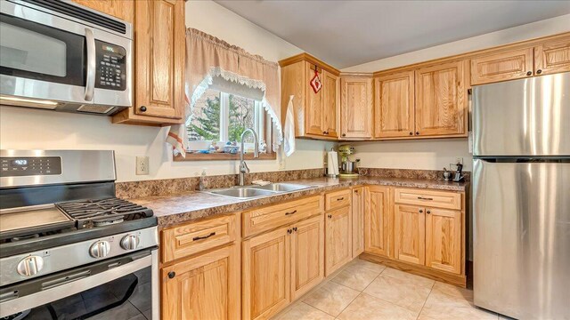 205 Flatbrook Way, Milford, PA 18337 - kitchen with light tile patterned floors, stainless steel appliances, and a sink