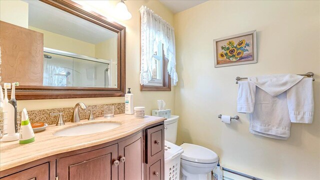 205 Flatbrook Way, Milford, PA 18337 - full bathroom featuring a shower stall, toilet, a baseboard radiator, and vanity