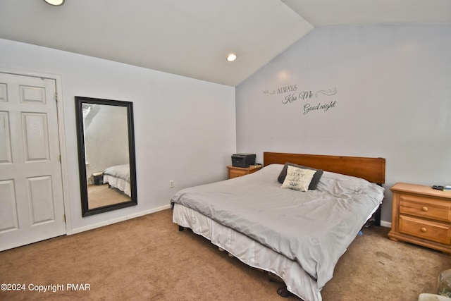 bedroom featuring carpet floors, baseboards, and lofted ceiling