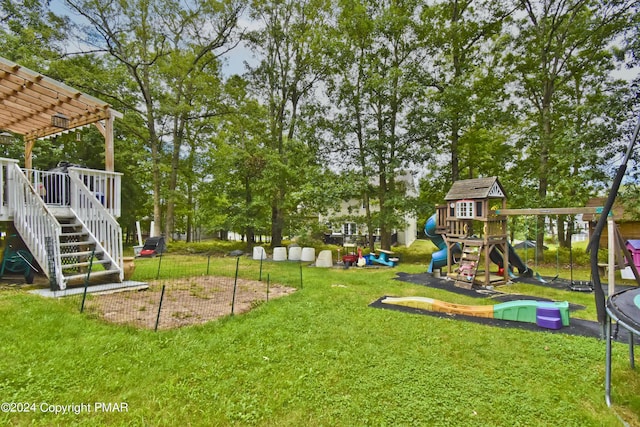 view of yard featuring a deck, a playground, stairs, a pergola, and a trampoline