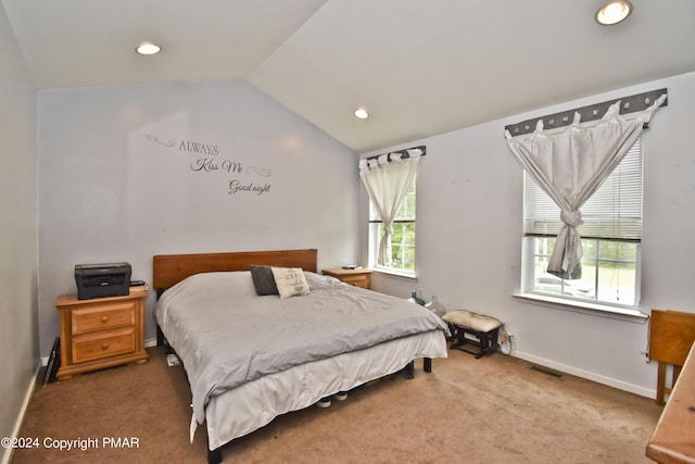 carpeted bedroom featuring baseboards, visible vents, vaulted ceiling, and recessed lighting