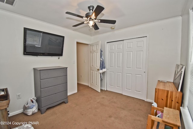 bedroom with carpet floors, a closet, visible vents, and baseboards