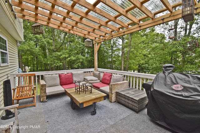 deck featuring an outdoor hangout area, grilling area, and a pergola