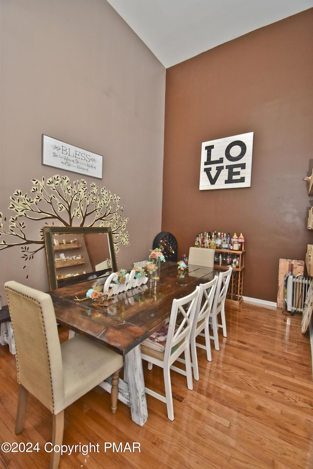 dining area featuring baseboards and wood finished floors