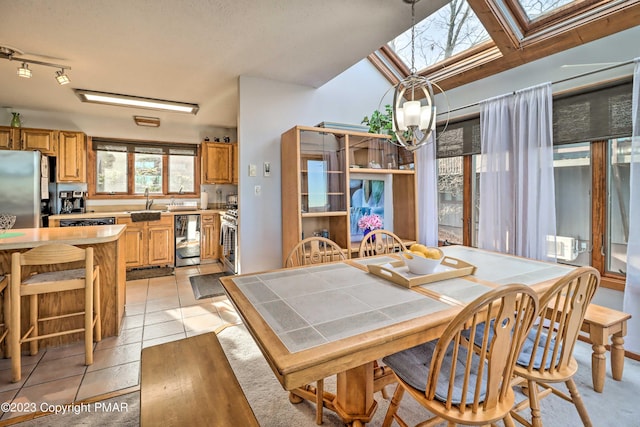 296 Overlook Way, Tannersville, PA 18372 - dining room featuring beverage cooler, light tile patterned floors, and a skylight