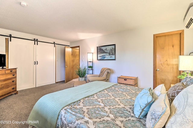 296 Overlook Way, Tannersville, PA 18372 - carpeted bedroom featuring an AC wall unit and a barn door