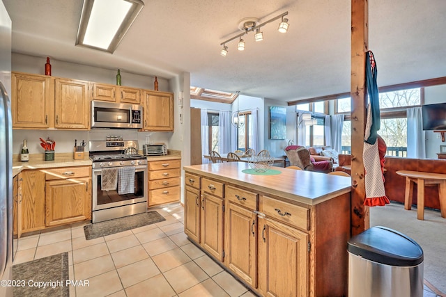 296 Overlook Way, Tannersville, PA 18372 - kitchen with light countertops, appliances with stainless steel finishes, light tile patterned floors, and open floor plan