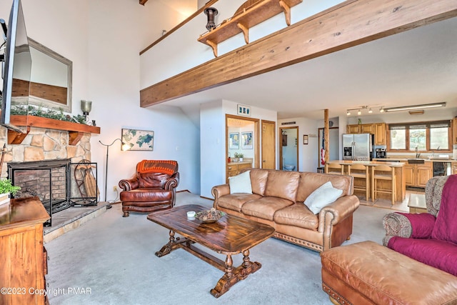 296 Overlook Way, Tannersville, PA 18372 - living area featuring light colored carpet and a fireplace