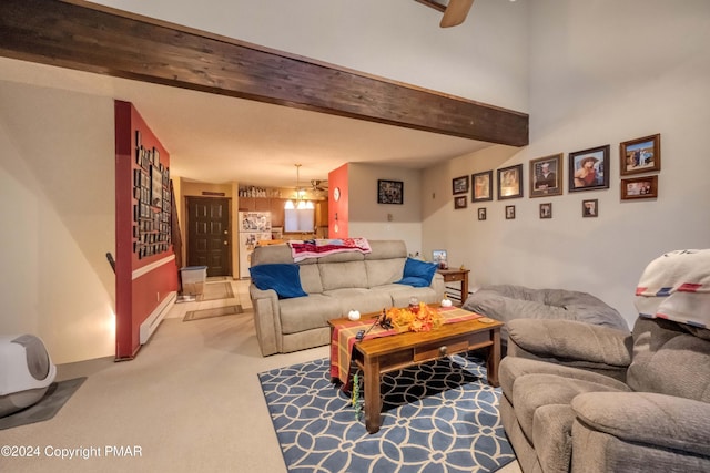 living area featuring a ceiling fan, baseboard heating, beamed ceiling, and carpet flooring