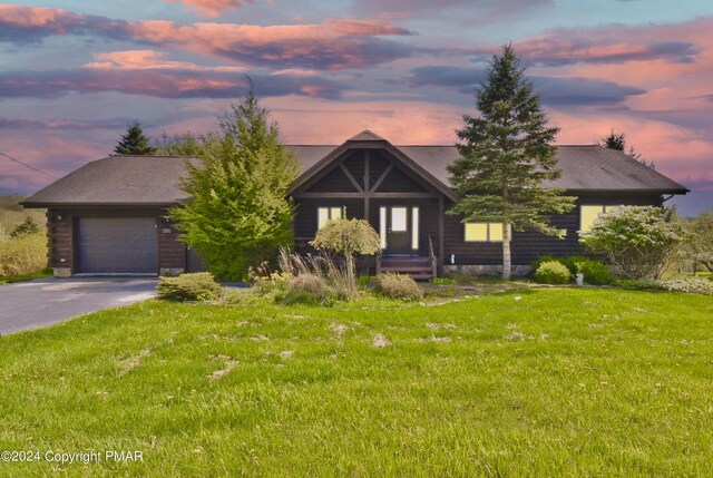 106 Windsor Dr, Lake Ariel, PA 18436 - view of front facade featuring a garage, concrete driveway, and a front lawn