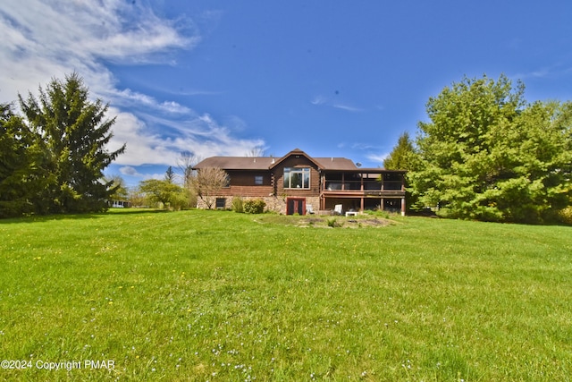 106 Windsor Dr, Lake Ariel, PA 18436 - rear view of house featuring a lawn and a wooden deck