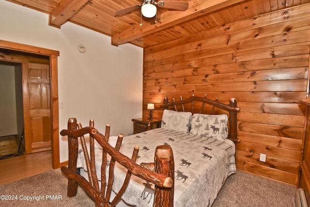 106 Windsor Dr, Lake Ariel, PA 18436 - bedroom with a wooden ceiling with exposed beams, carpet flooring, baseboard heating, and wooden walls