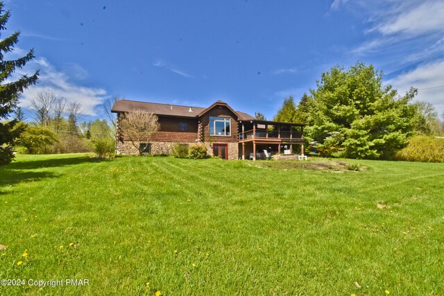 106 Windsor Dr, Lake Ariel, PA 18436 - rear view of house with a yard, log siding, and a deck