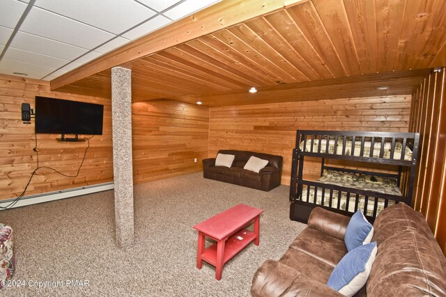 106 Windsor Dr, Lake Ariel, PA 18436 - carpeted living area featuring wooden walls and a baseboard heating unit