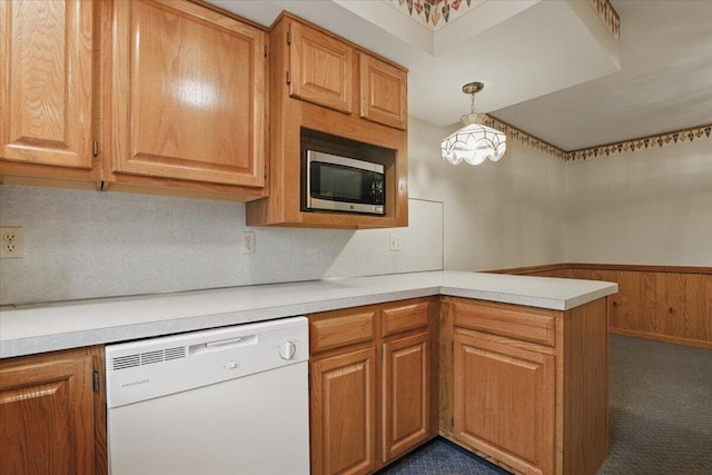 20 Cleveland Ave, East Bangor, PA 18013 - kitchen featuring dishwasher, stainless steel microwave, a peninsula, light countertops, and a wainscoted wall